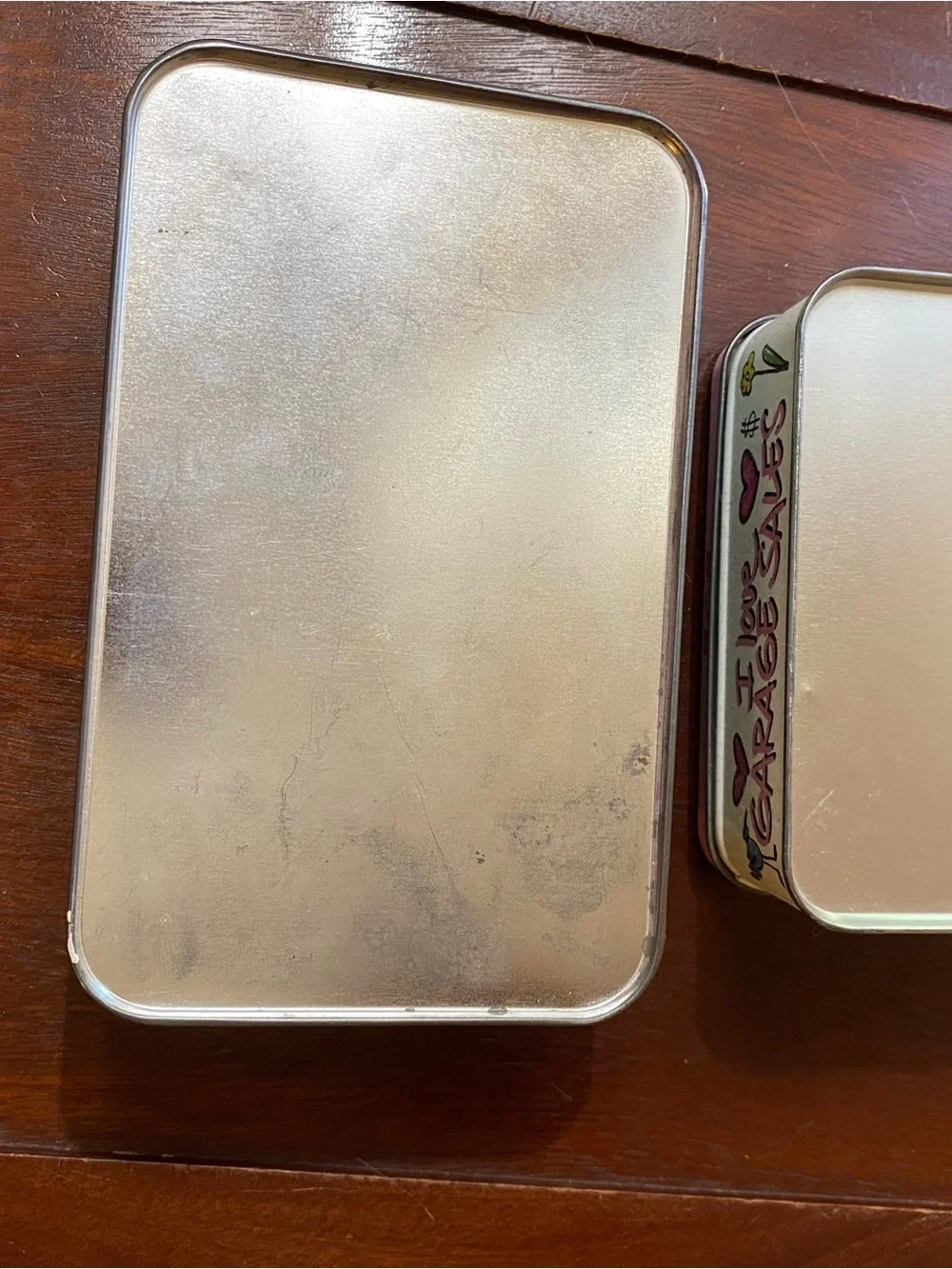 Two vintage tin containers